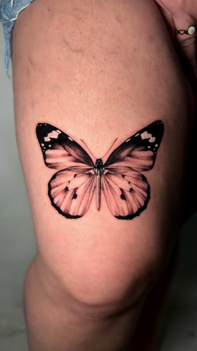 Finished butterfly tattoo with delicate linework