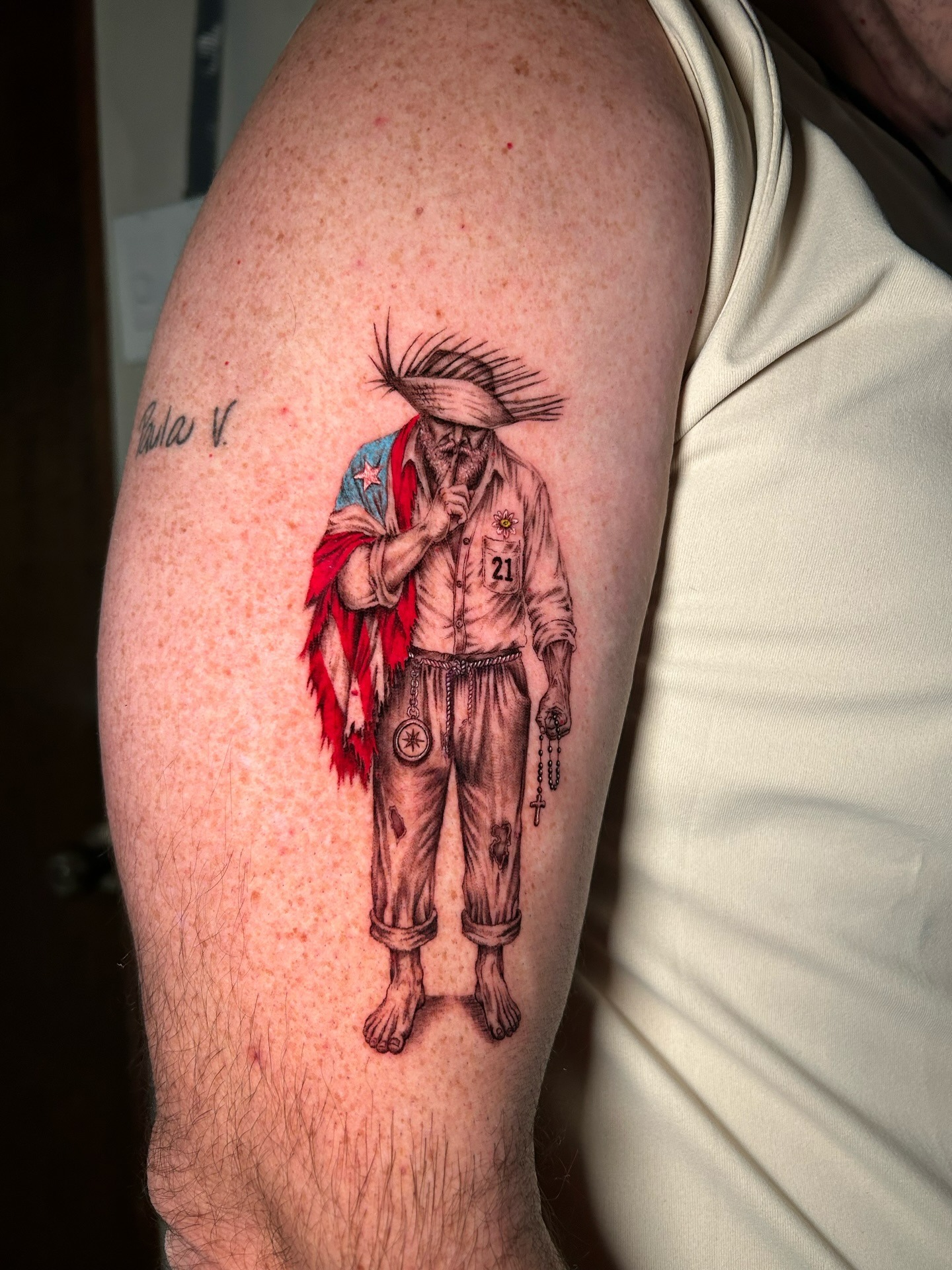 Finished tattoo artwork with detailed shading and a jibaro-inspired portrait composition